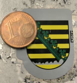 Oberfläche mit Münze abrubbeln